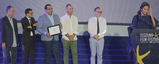 Managing Director Ahmed Fahmy Presents iProductions Award to Gaza DC by Director Rashid Masharawi